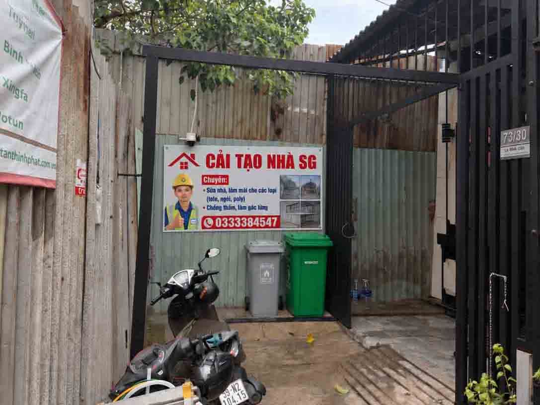 Bảng hiệu Cải Tạo Nhà SG trước cổng 73/30 Lê Đình Cẩn